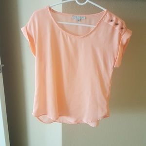 Peach colored blouse